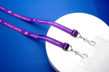 Purple Hobart and William Smith Colleges 2022 Reunion lanyards with silver metal swivel hooks and clear plastic badge holders.