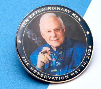 Round challenge coin featuring a portrait of a man holding a cigar, with text reading Ten Extraordinary Men, The Reservation May 14, 2024.