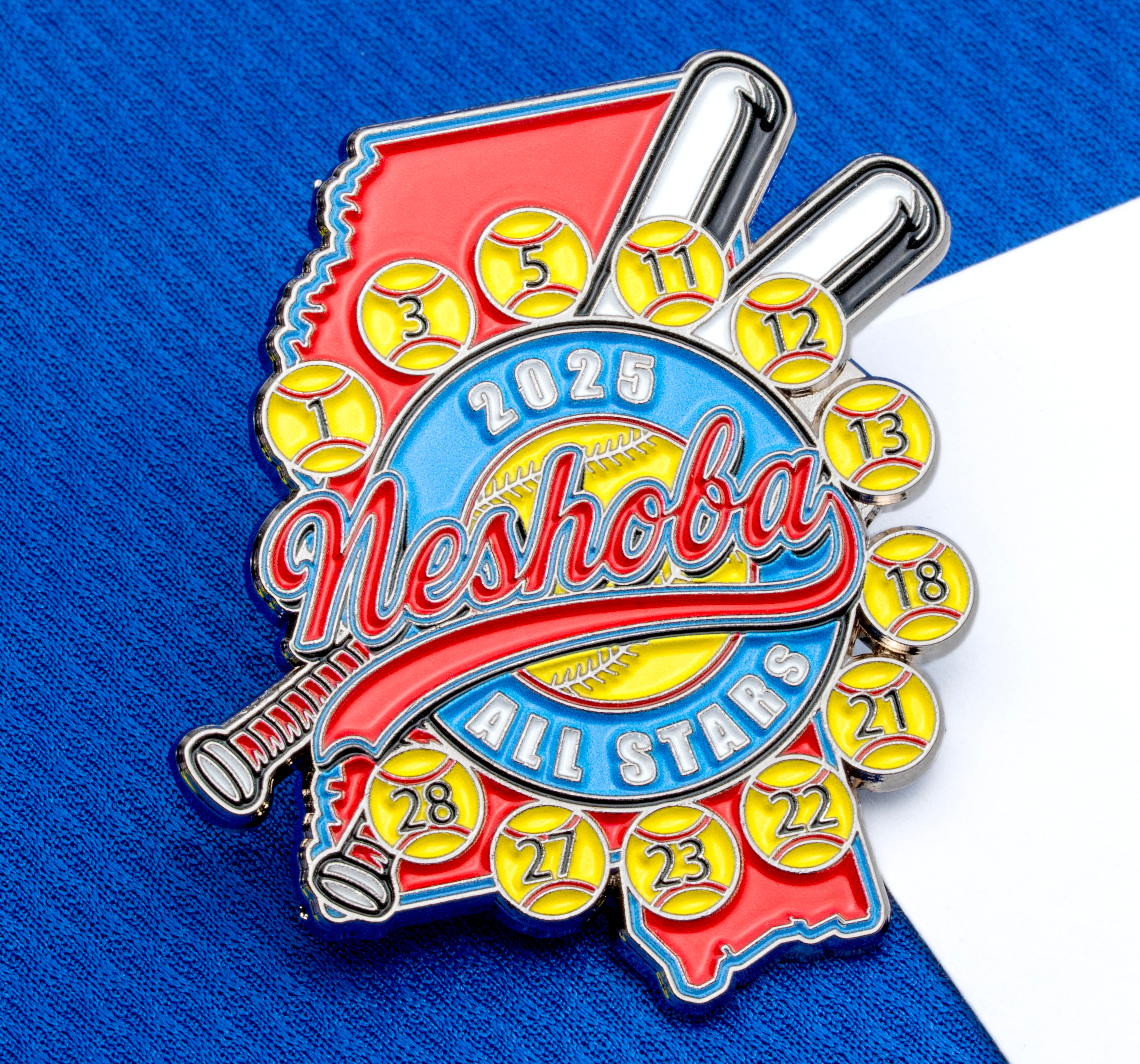 Custom enamel lapel pin for Neshoba All Stars 2025 featuring a softball theme with player numbers, bats, and a state map outline.