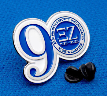 Enamel lapel pin with a large white and blue number 9 and a circular seal for Zeta Phi Beta Sorority, Xi Zeta Chapter, featuring greek letters and years 1935-20