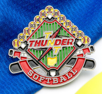 Enamel trading pin for Thunder Softball featuring a baseball diamond design with crossed bats, a lightning bolt, and player numbers on softballs.