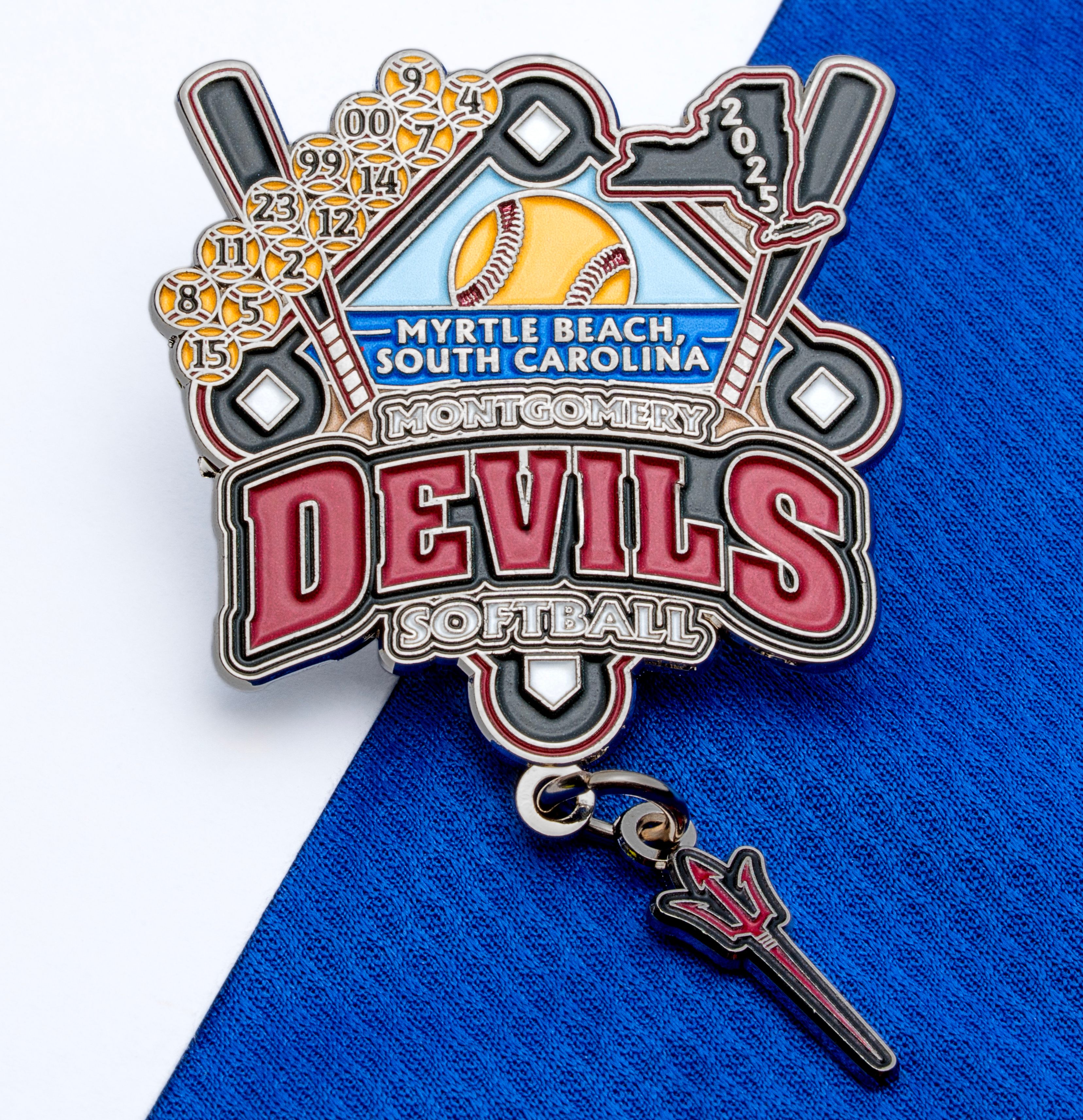 Softball trading pin for Montgomery Devils featuring bats, a yellow ball, Myrtle Beach text, and a dangling pitchfork charm.