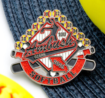 Custom enamel trading pin for Ambush Ozark Softball featuring red glitter, crossed bats, a player silhouette, and softballs with player numbers.