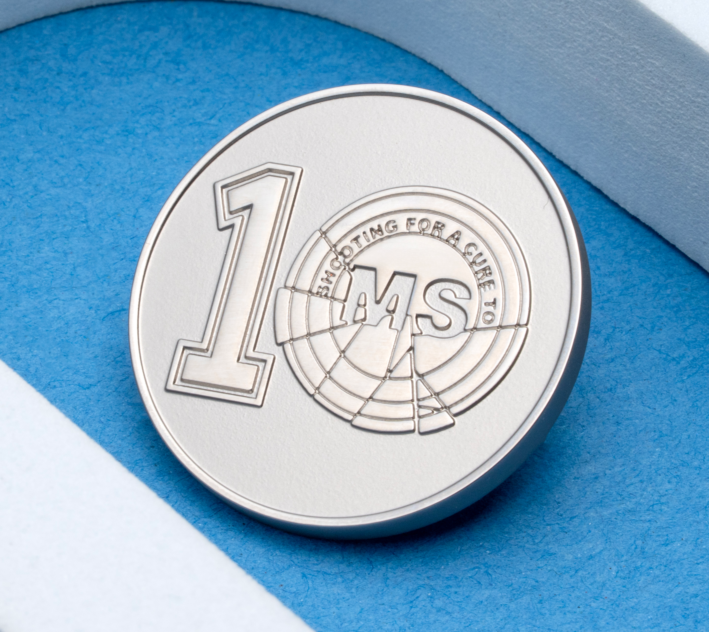 map[name:Silver round challenge coin with a number 1 and a bullseye logo containing the letters MS, positioned within a white arch on a blue background. naturalSort:Silver round challenge coin with a number 00000000000000000000000000000001.00000000000000000000000000000000  and a bullseye logo containing the letters MS, positioned within a white arch on a blue background.]