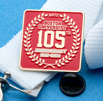 Square red and gold enamel lapel pin for Boston University ROTC 105th Anniversary, featuring a laurel wreath and dates 1919-2024 on a white lanyard.