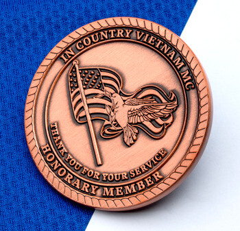 Antique copper challenge coin for In Country Vietnam MC Honorary Member featuring a dove and American flag design.