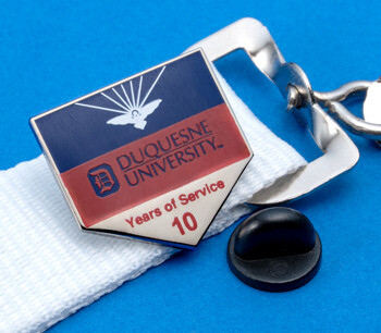 Duquesne University 10 Years of Service lapel pin with blue, red, and silver enamel on a white lanyard.