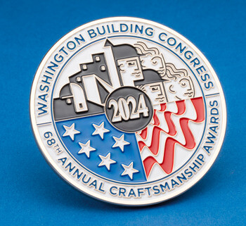 Circular medallion for the 68th Annual Craftsmanship Awards featuring the year 2024, architectural motifs, and patriotic stars and stripes on a blue background.