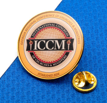 Gold circular lapel pin with ICCM logo and International Congress of Churches & Ministers text on a blue textured background.