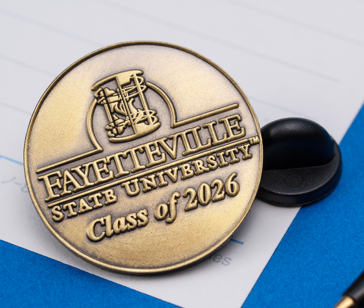 Antique gold Fayetteville State University Class of 2026 lapel pin with black rubber clutch.