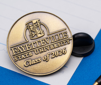 Antique gold Fayetteville State University Class of 2026 lapel pin with black rubber clutch.