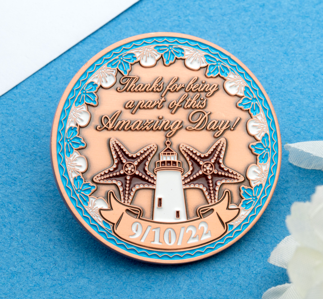 Circular challenge coin featuring a lighthouse, starfish, and blue floral border with the text Thanks for being a part of this Amazing Day 9/10/22.