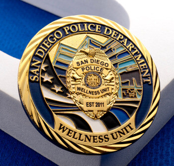 Gold-plated San Diego Police Department Wellness Unit challenge coin featuring a central badge emblem, stars, and blue enamel accents.