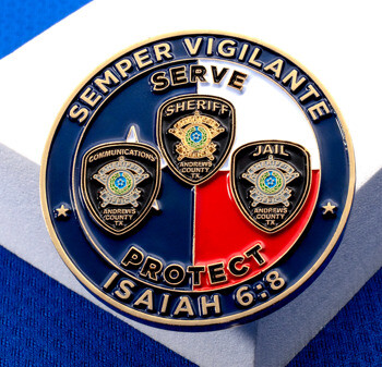 Circular challenge coin featuring Andrews County Sheriff, Jail, and Communications badges with a red, white, and blue background.