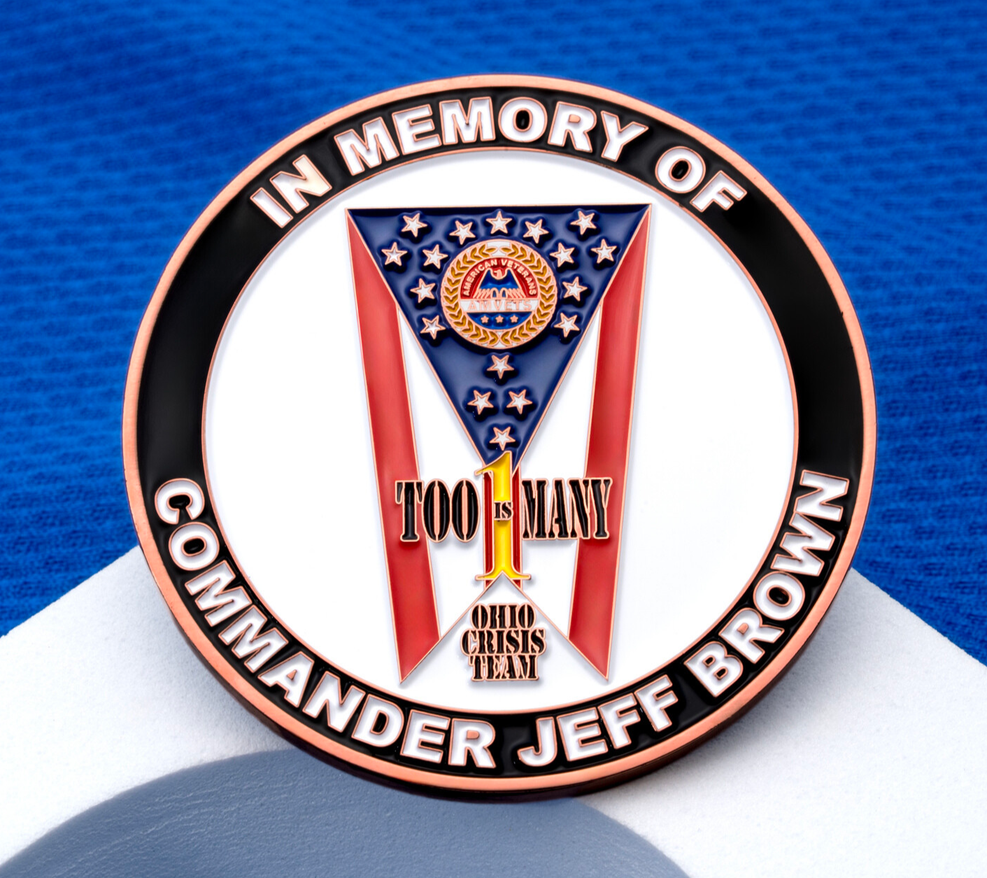 Memorial challenge coin for Commander Jeff Brown featuring the Ohio Crisis Team logo and stars and stripes design.