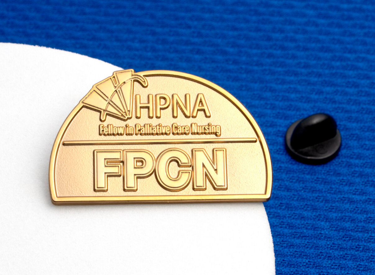 Gold lapel pin featuring the HPNA logo and FPCN Fellow in Palliative Care Nursing text.