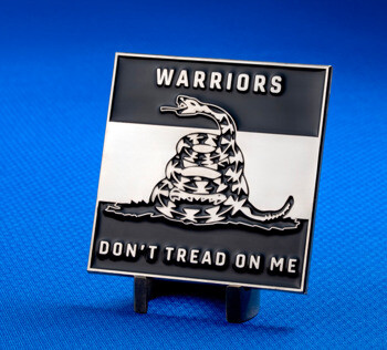 Square enamel lapel pin featuring a coiled rattlesnake Gadsden flag design with 'Warriors' and 'Don't Tread On Me' text on a blue background.