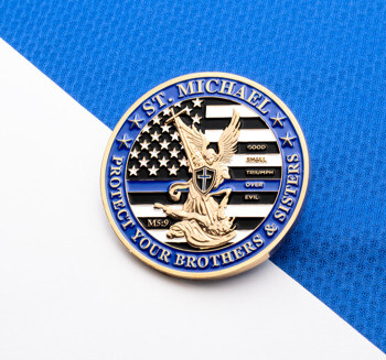St. Michael challenge coin featuring a thin blue line American flag background and an angel defeating a demon.