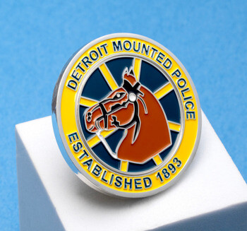 Circular Detroit Mounted Police challenge coin featuring a horse head illustration, yellow border, and blue background.