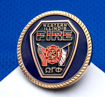 Western Illinois Fire challenge coin featuring a blue background, gold rope edge, a shield emblem, flags, and the Greek letters Omega Gamma Phi.