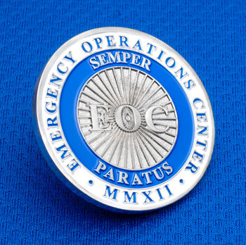 Emergency Operations Center challenge coin featuring EOC initials, Semper Paratus text, and blue enamel details.