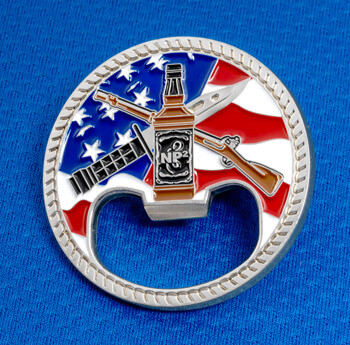 Circular challenge coin bottle opener featuring an American flag background, a central whiskey bottle marked NP2, rifles, and a knife design.