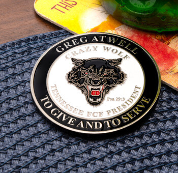 Custom circular challenge coin featuring a snarling black wolf head design with the text Greg Atwell Crazy Wolf, Tennessee FCF President.