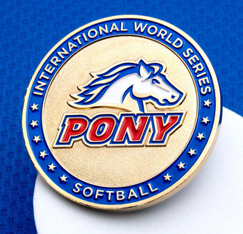 Pony International World Series Softball challenge coin with a blue, white, and red horse logo on a gold background.