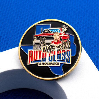 Circular challenge coin featuring the Nate's Auto Glass & Recalibration logo with a red truck and Texas shape on a black background.